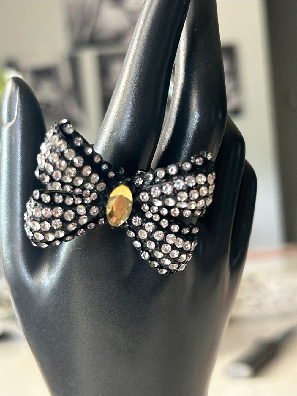 Betsey Johnson sparkly rhinestone bow stretch ring with a central large gem